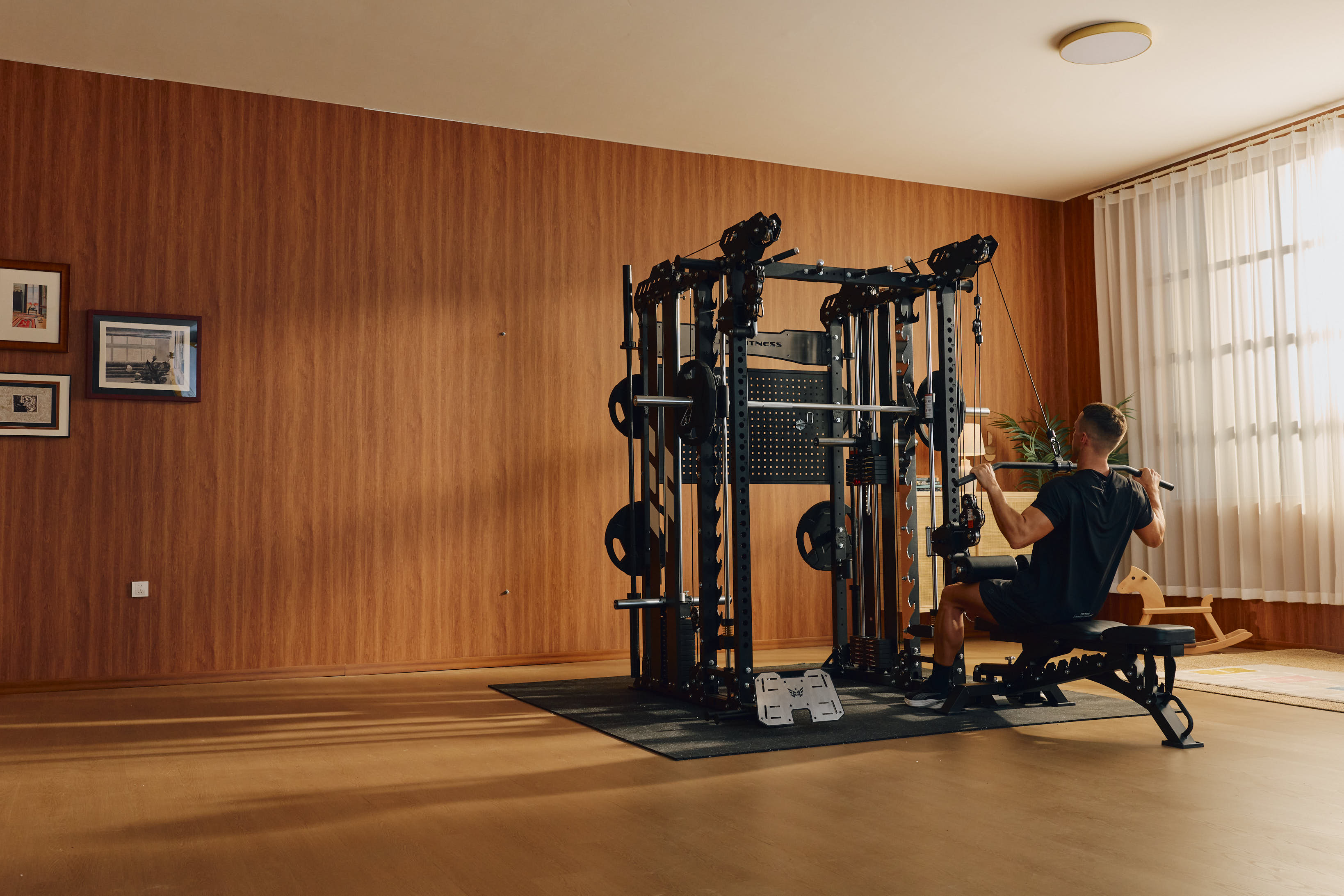 A man doing lat pulldown in home gym